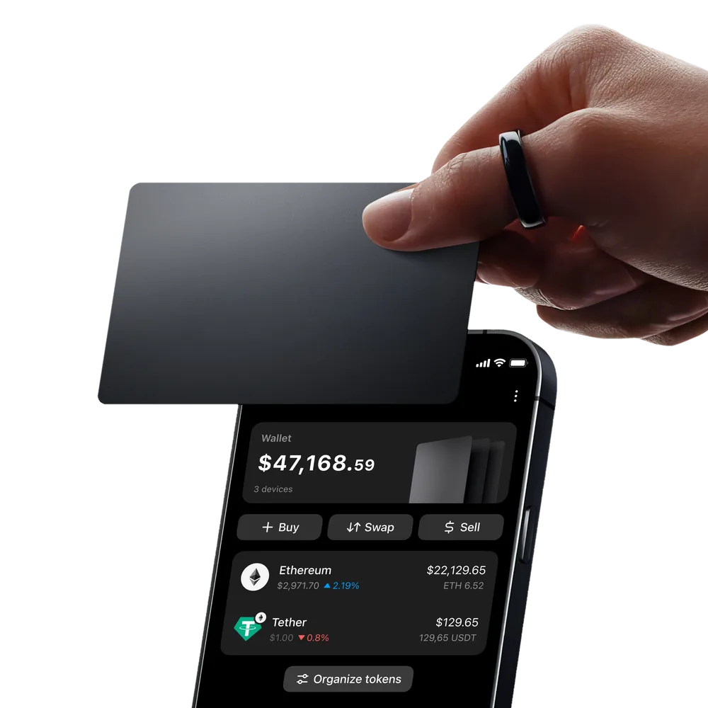 Tapping a Tangem card against a smartphone to check the balance